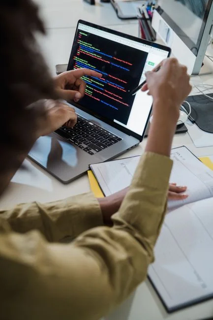 A tablet with a financial website open, alongside a white keyboard and mouse. Ideal for tech-theme stock images.